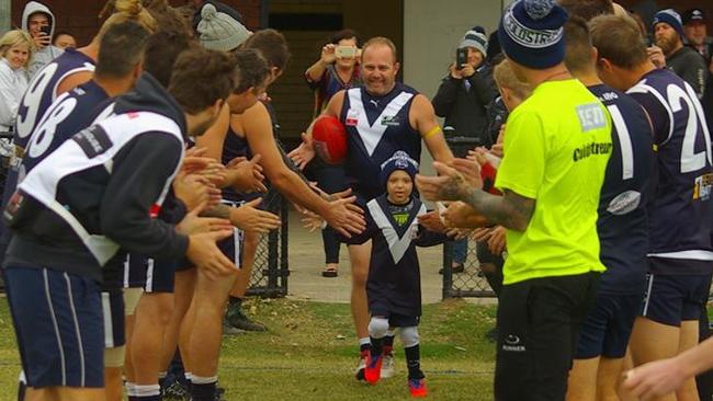 Lawson Appleton leads Coldstream onto the ground on Saturday. Picture: Supplied