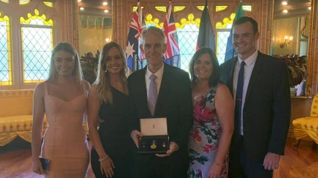 Gerard Price with his wife Jane and children Bethany, Erin, and Damian at his OAM ceremony. Picture: Supplied