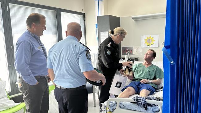 Queensland Police Commissioner Katarina Carroll speaks with Senior Constable Steven Ingerson about his recovery. Picture: Queensland Police