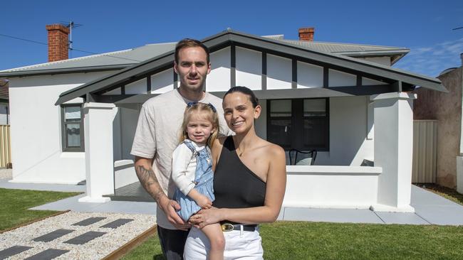 Kellie and Jeremy Finlayson with their daughter Sophia. Picture: Mark Brake