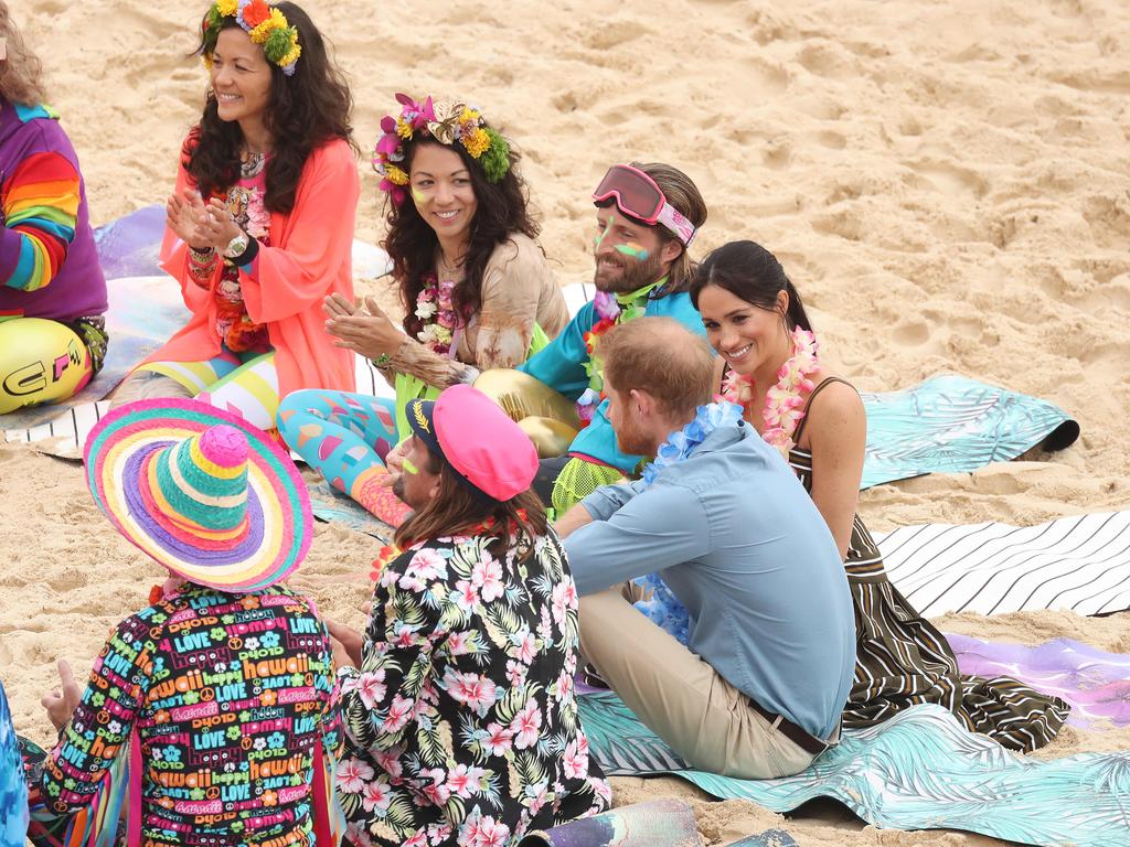 Prince Harry and Meghan Markle visit Bondi Beach to meet a local surfing community group raising awareness for mental health and wellbeing known as OneWave. Picture: Brett Costello