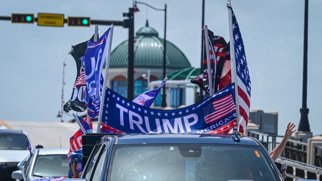 Supporters of former US president and Republican presidential candidate Donald Trump participate in the "In Trump We Trust" caravan near his Mar-a-Lago resort in West Palm Beach, Florida, a day after the attempt to assassinate him. Picture: AFP