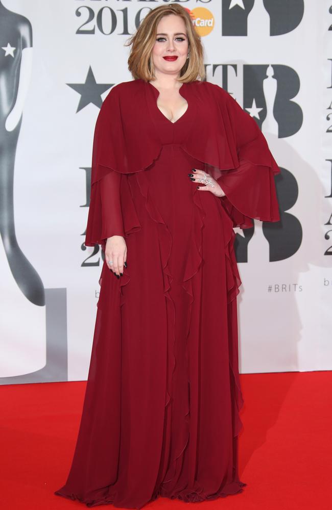 Experimenting with colour ... singer Adele opted for a red gown instead of her preferred black. Picture: Joel Ryan/Invision/AP