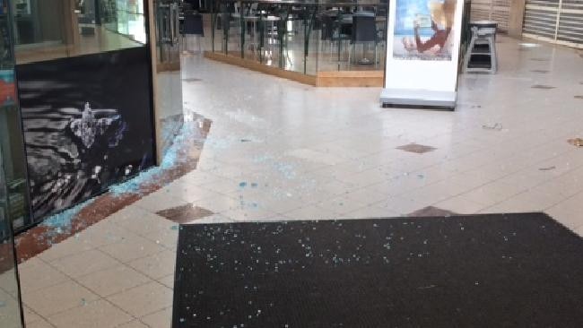 Shattered glass inside the Niecon Plaza at Broadbeach after a table flew off a highrise in strong winds. Picture: Amanda Robbemond