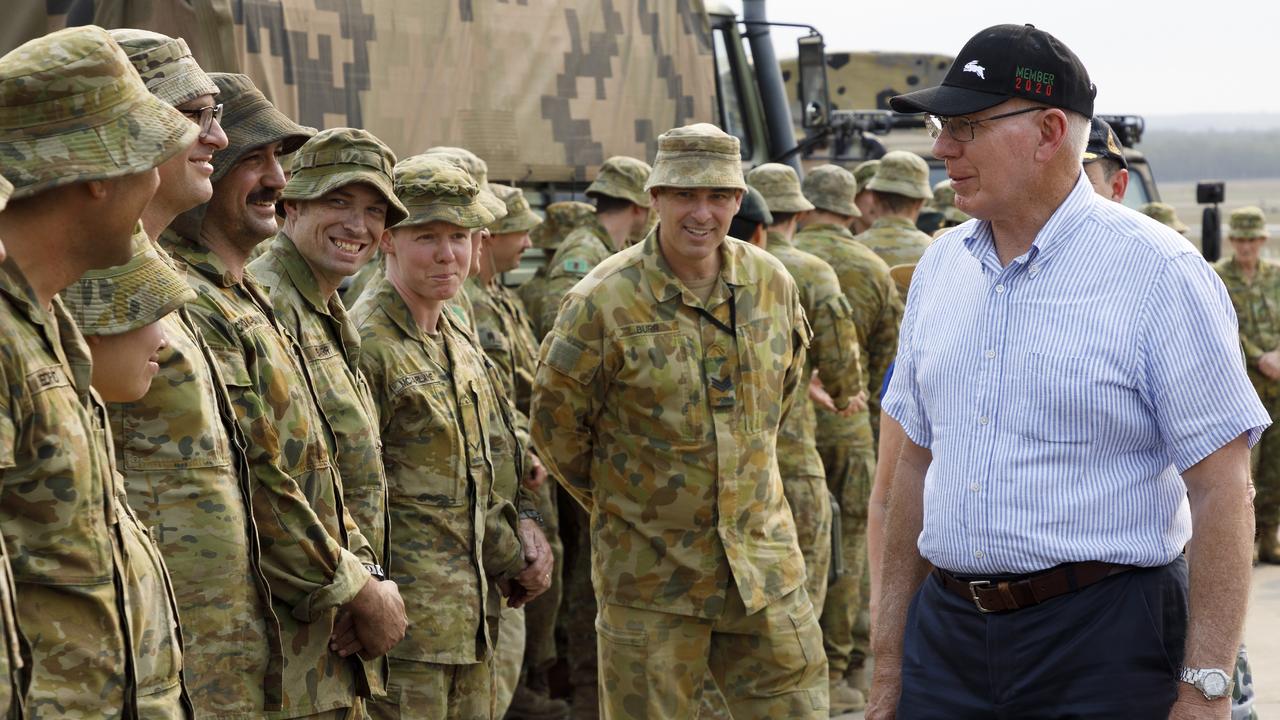 David Hurley wearing his Rabbitohs cap during a chat with army members.