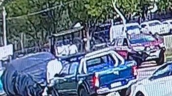 CCTV shows the brawl unfolding from afar before several people run down the street. Picture: TNV