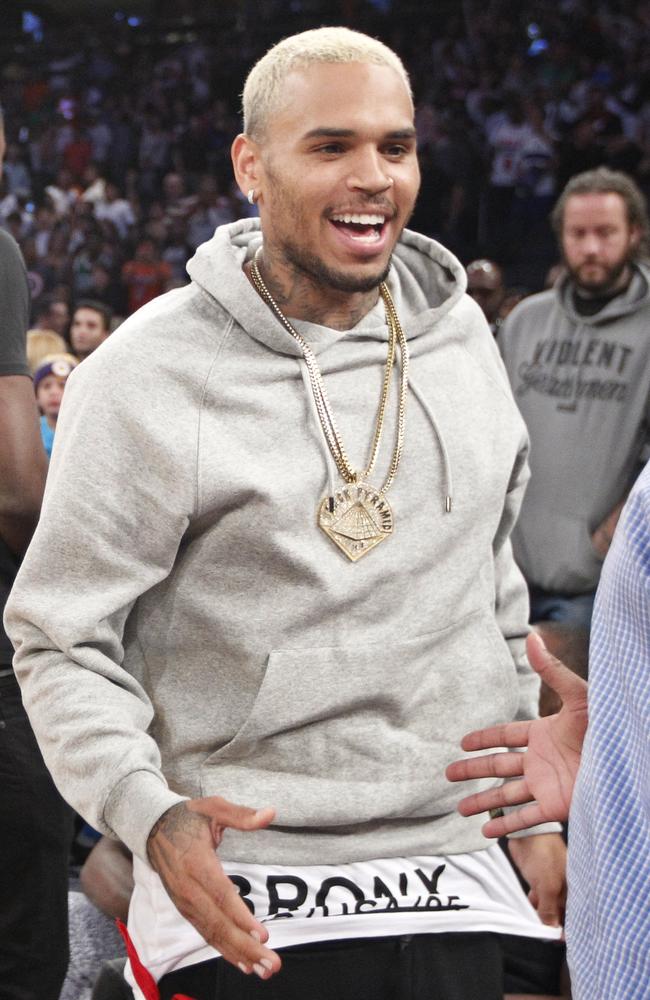 Unscathed ... Chris Brown, pictured at the basketball in New York last week, was hosting the nightclub party.
