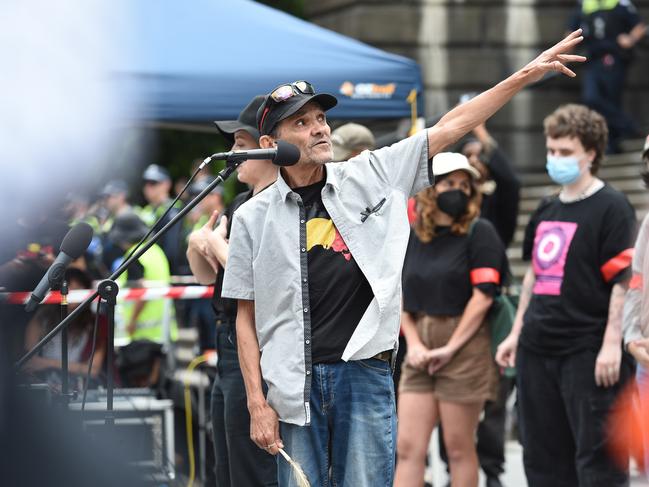 Speakers address the crowd outside Parliament House.