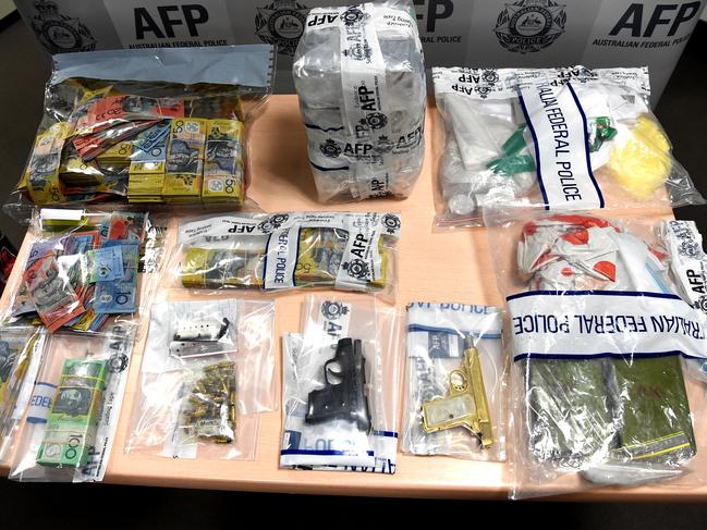 <s1>Items seized by federal police in western suburbs raids after they smashed a drug ring this week.</s1>