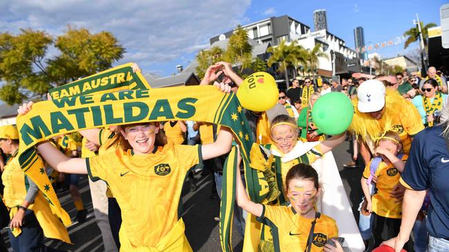 Fans make their way along Caxton St before the match. Picture: Patrick Woods