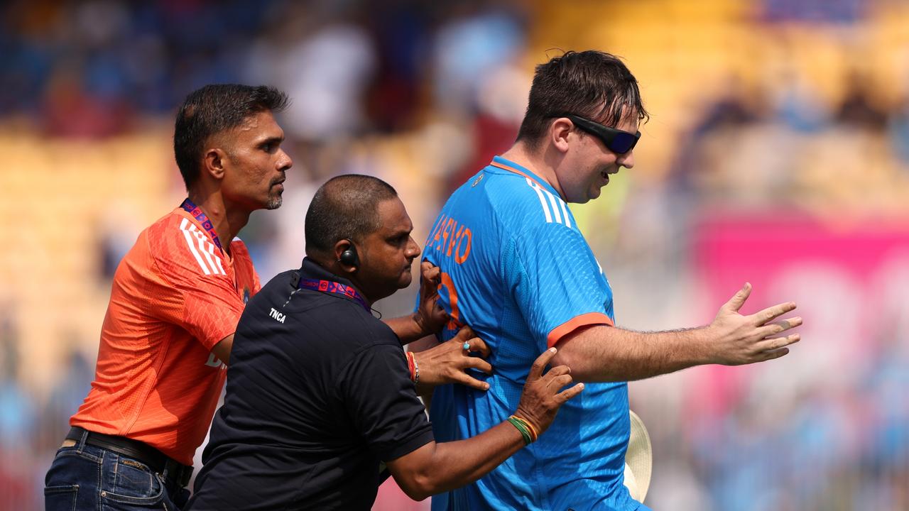 Security escort Jarvo off. Photo by Robert Cianflone/Getty Images