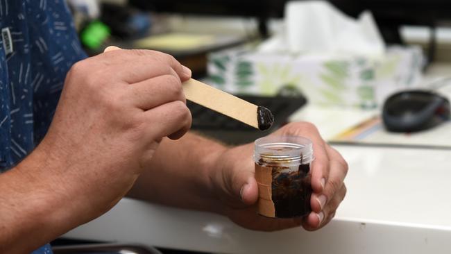 An example of black salve, an alternative topical therapy used to treat skin cancer.