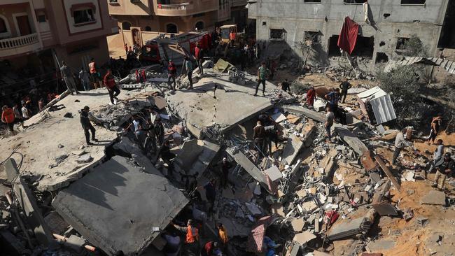 Palestinians check the rubble of an Israeli strike on Rafah, in the southern Gaza Strip. Picture: Said Khatib/AFP