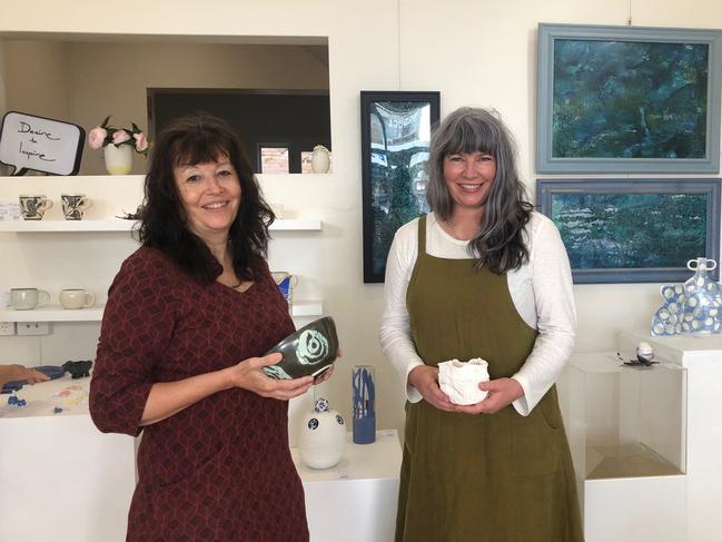 Two of the artists - Bridget Willis and Carline Wright - at Crackpot on Lawrence St, Freshwater, which is a new gallery and ceramic studio. Picture: Julie Cross.