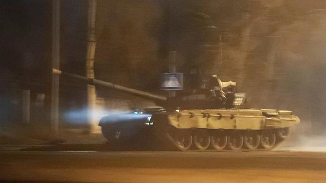 A tank drives along a street after Russian President Vladimir Putin ordered the deployment of Russian troops to two breakaway regions in eastern Ukraine. Picture: REUTERS/Alexander Ermochenko