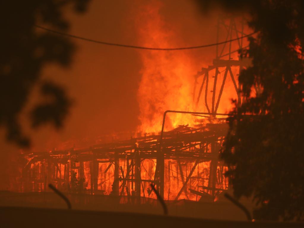 “We can see it coming over the hill” ... fire burns in Batlow, near Tumbarumba. Picture Rohan Kelly