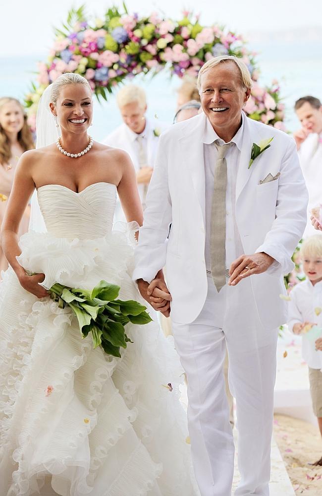 Kristy Hinze with billionaire husband Jim Clark during their wedding ceremony on the beach at the Little Dix Day Resort in the Carribbean in 2009.