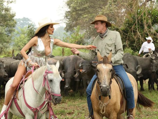 Kate Santos on a calendar shoot in 2018, with Armstrong. The horse he is pictured riding was later stolen for its meat. Picture: Supplied