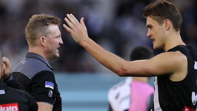 Nathan Buckley talks with Darcy Moore. Picture: Michael Klein