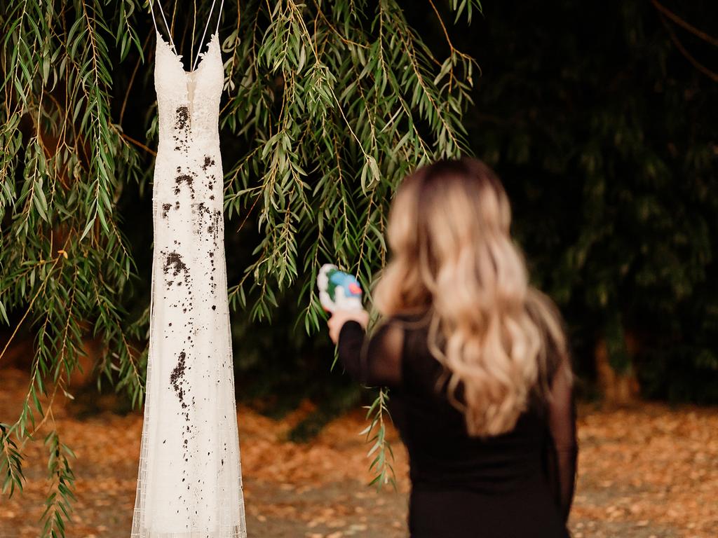 She painted her wedding dress. Picture: Caters News