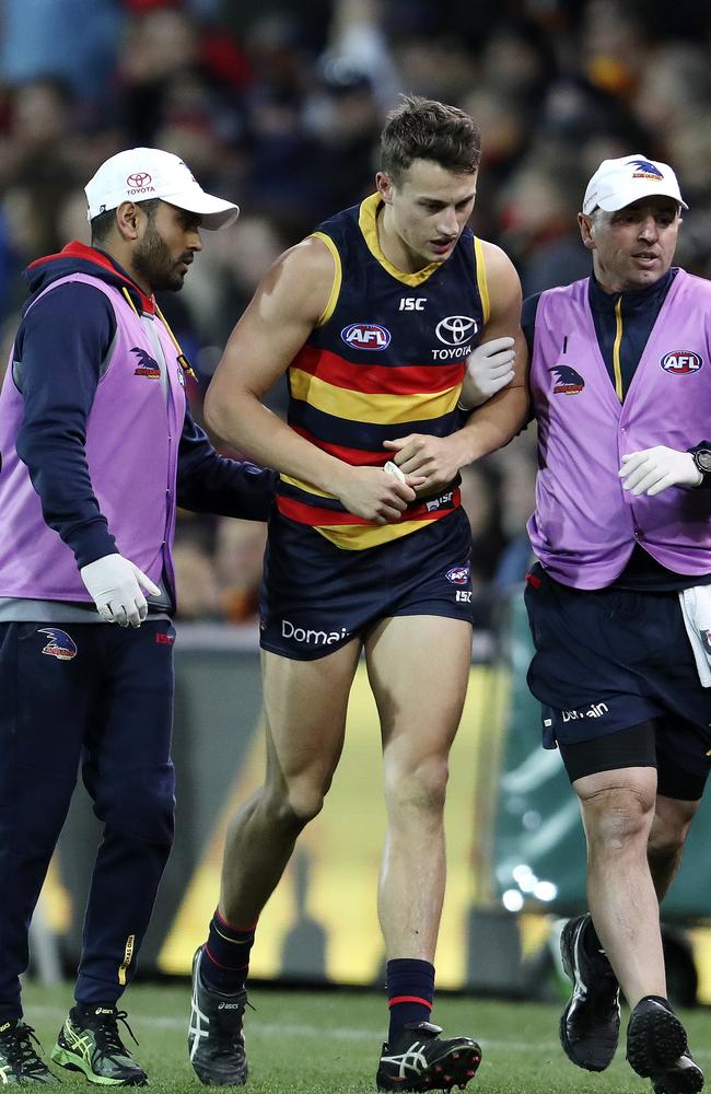 Rising star contender Tom Doedee leaves Adelaide Oval with a suspected broken collarbone on the weekend. Picture: Sarah Reed.