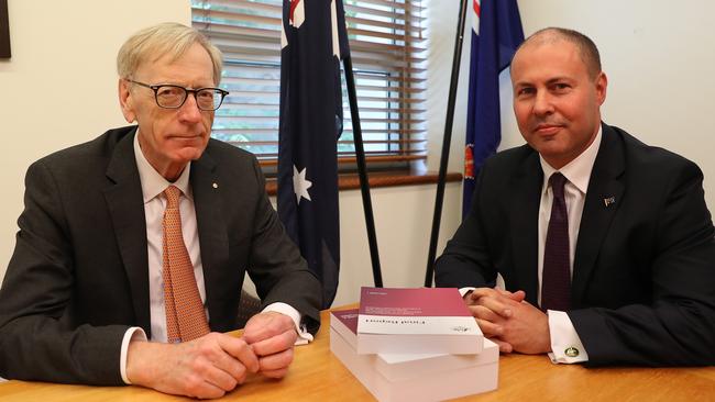 Commissioner Kenneth Hayne and Treasurer Josh Frydenberg with the final report from the royal commission. Picture: Kym Smith