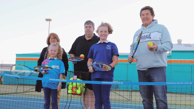 Councillor Sheryl Windle, Maggie Stevens, Nathan Costello, Charlotte Stevens and Councillor Marco Gliori celebrate the Warwick and District Tennis Association’s grant.