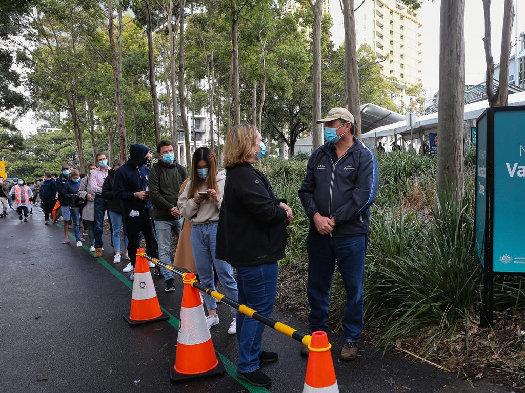 Long queues of people form at the Olympic Park Vaccination Hub in Sydney. Picture: NCA NewsWire/Gaye Gerard