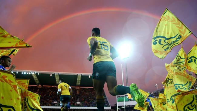 Israel Folau runs onto nib Stadium under a rainbow. Picture: Getty