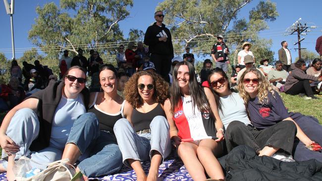 Michaela Humphries, Megan Osmond, Natalia Smith Diaz, Verity Boustead, Sophie Trinh, and Bridget Maude at Traeger Park, Alice Springs, for the Demons Saints game on June 1, 2025. Picture: Gera Kazakov