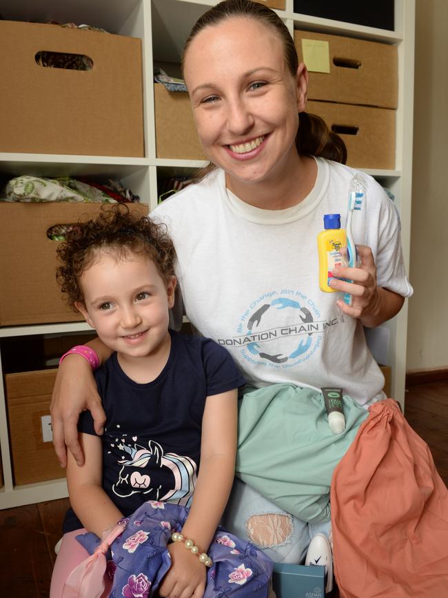 Helena Blomeley (pictured with daughter Alexis) started the Donation Chain charity which provides reusable bags packed with toiletries for needy. Picture: AAP/Chris Eastman