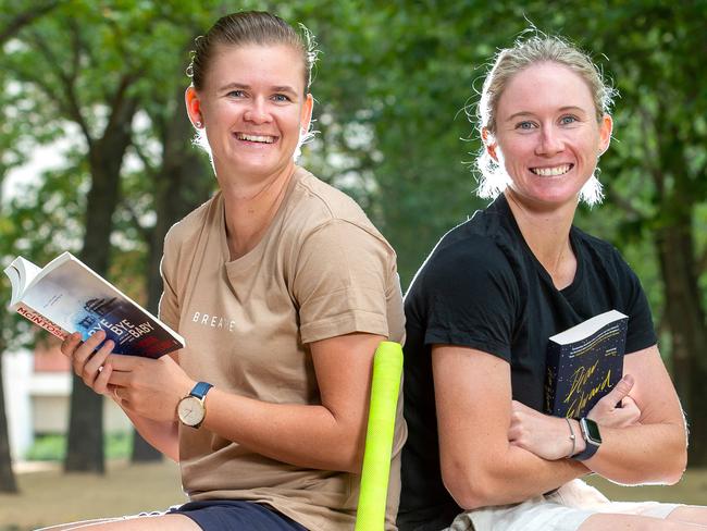 T20 Cricketers Beth Mooney & Jess Jonassen catching up on their reading.Picture Jay Town