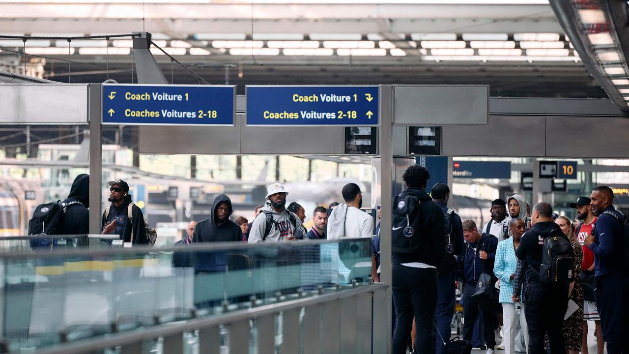 Unfamiliar scenes for Team USA at the train station. (Photo by Benjamin Cremel/AFP)