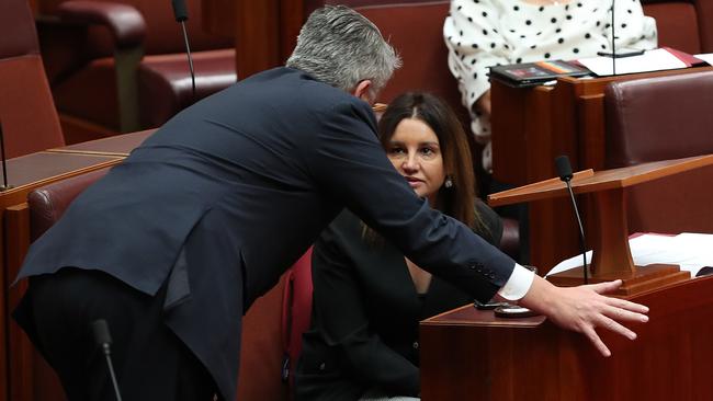 Mathias Cormann talks with Jacqui Lambie in the Senate. Picture: Kym Smith