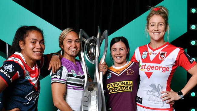 Players with the new NRL trophy.