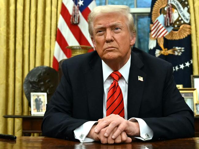 TOPSHOT - US President Donald Trump speaks to the press after signing an executive order in the Oval Office of the White House in Washington, DC, on February 10, 2025. (Photo by ANDREW CABALLERO-REYNOLDS / AFP)