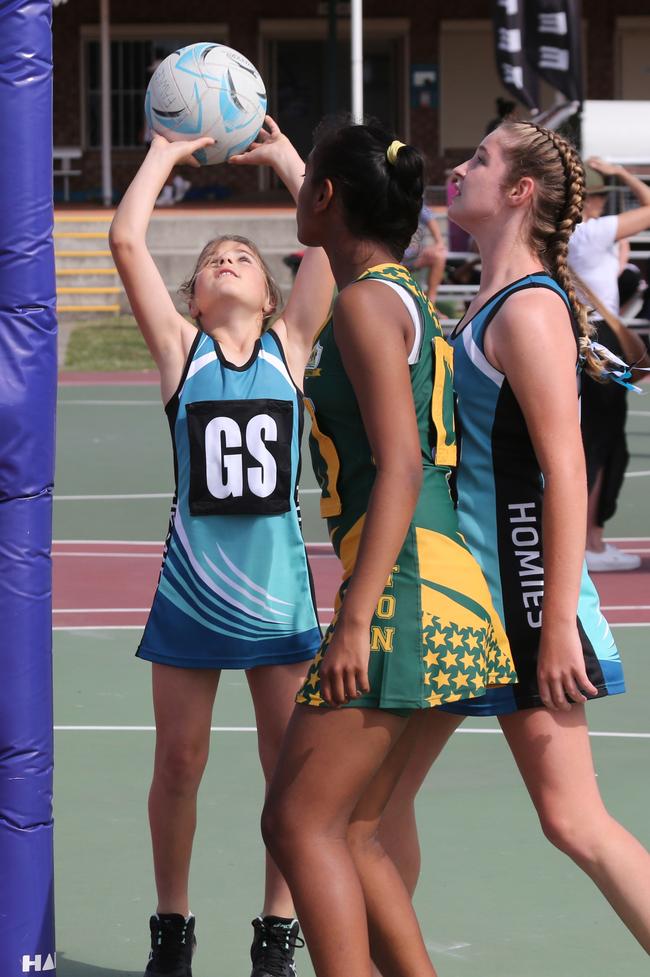 The Netball Qld Primary Schools Cup grand finals are being held at the Hinterland District Netball Association at Mudgeeraba. Homies (home schooled kids) player Scarlett Fawcett in action against Gilston's Mehak Maharaj. Picture: Mike Batterham.