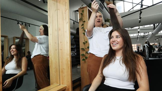 Stylist Maddison Stewart, with Tiarne Cooney at the EdwardsAndCo salon in Sydney’s Surry Hills. She says demand for high-end service has grown. Picture: John Feder