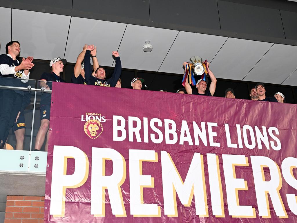 Lions players unfurling the flag in Brisbane in 2024. Picture: Bradley Kanaris/Getty Images.