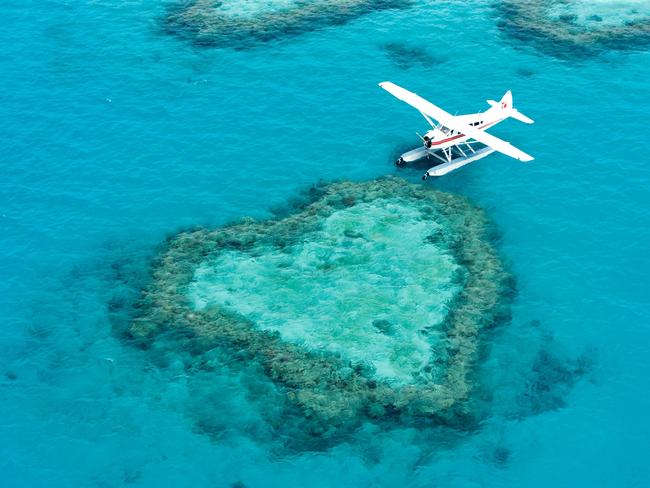 GSL Aviation's seaplane next to Heart Reef in the Whitsundays. Picture: GSL Aviation