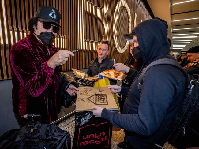 Gene Simmons signs autographs for fans upon arrival at Melbourne Airport to begin the Australian leg of the End of the Road Tour. Picture: Jake Nowakowski