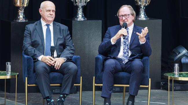 Leigh Matthews and Kevin Sheedy during the State Memorial Service to honour the life of Ron Barassi at the MCG. Picture: Aaron Francis