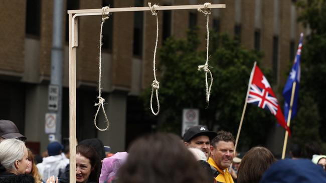 A mock gallows with nooses is carried at a rally against the Andrews government’s proposed pandemic laws. Picture: Daniel Pockett