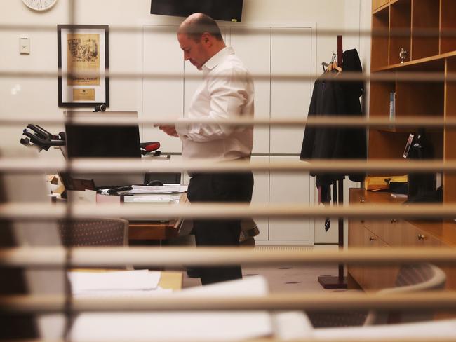 Treasurer Josh Frydenberg talks on the phone in his office at night on Wednesday, September 30, 2020 ahead of the budget next Tuesday. Picture: Adam Taylor