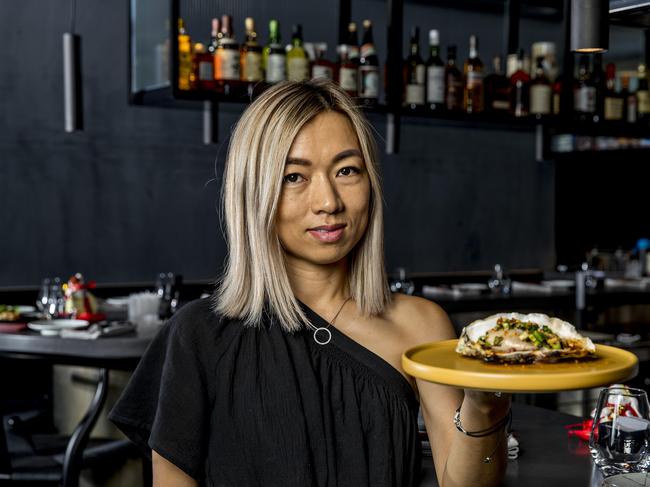 Eddy + Wolf owner Thao Nguyen holding the Jumbo Oyster dish. Picture: Jerad Williams