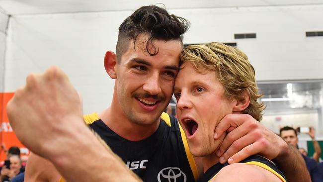 Taylor Walker and Rory Sloane celebrates the Crows’ win in the 2017 preliminary final. Picture: Getty Images