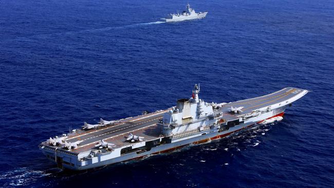 The Chinese aircraft carrier Liaoning (Hull 16) steams in the western Pacific during a combat exercise.