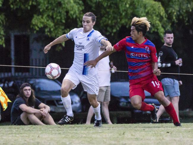 Surfers Paradise Apollo's Dylan Barwick and Nerang winger Koki Miyasaka in action in the Gold Coast Premier League on Saturday night. Picture: Luke Sorensen