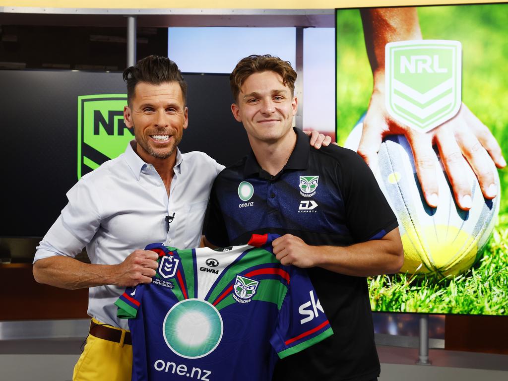 Luke Metcalf presents Las Vegas Now host JC Fernandez with a Warriors jersey after being interviewed live on air at their KLAS-TV Channel 8 studio in Las Vegas. Picture: Jonathan Ng