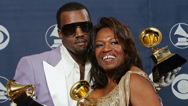 Kanye West and his mother Donda hold his three awards backstage at the 20006 Grammy Awards.